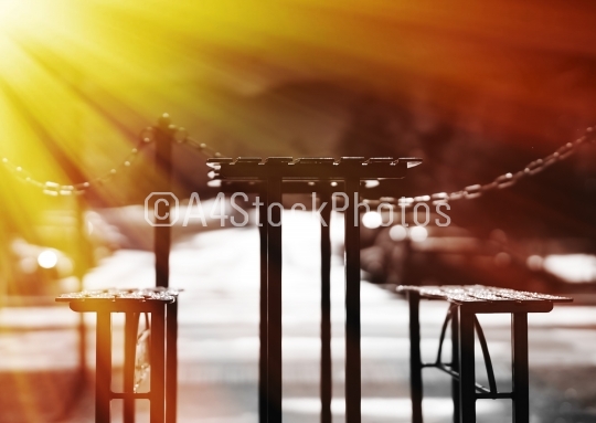 Cafe table with benches with light leak backdrop