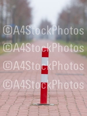 Close up, red and white traffic pole