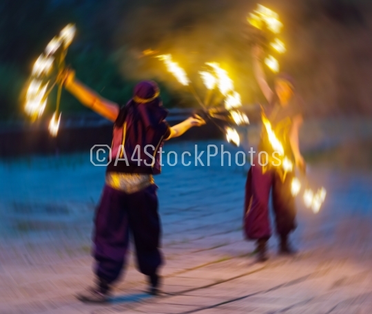 Horizontal vivid two female fakir playing with fire motion abstr