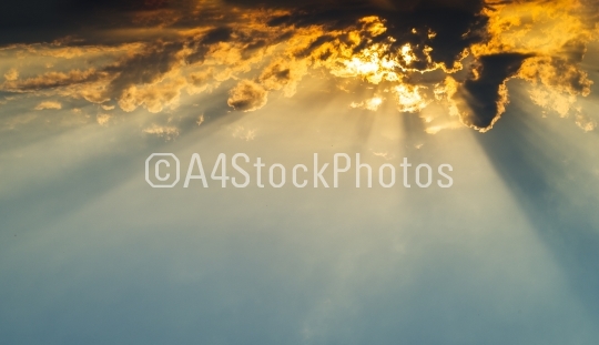 Horizontal vivid vibrant cloudscape with sun rays background bac