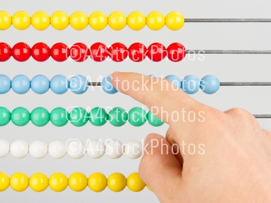 A man using an abacus on a white background