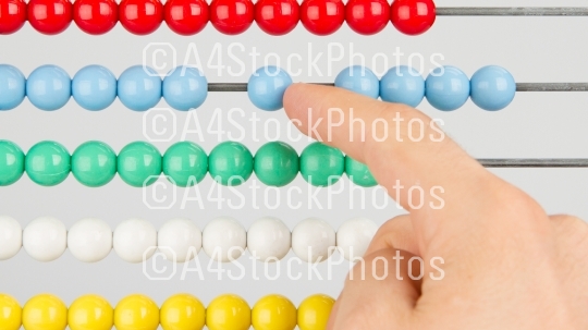 A man using an abacus on a white background