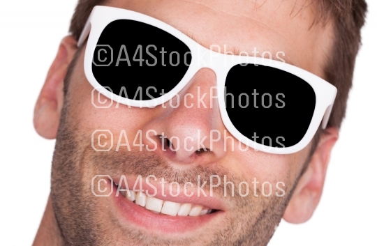 Close-up of a man wearing white sunglasses 