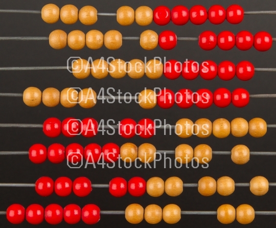 Close-up of an old abacus on a grey background
