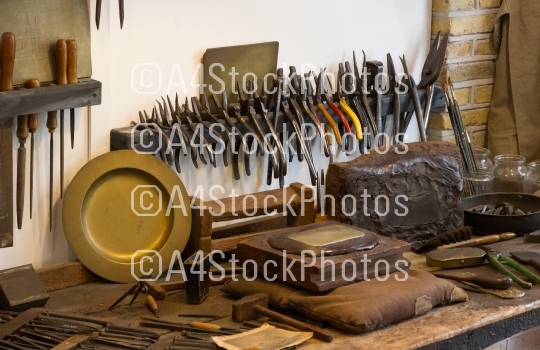 Collection of vintage woodworking tools on a rough workbench