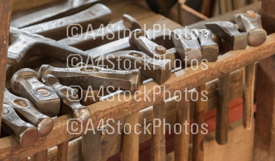 Collection of vintage woodworking tools on a rough workbench