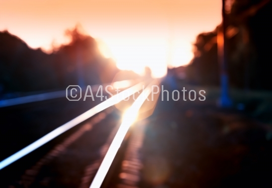 Diagonal burning sunset railway bokeh background