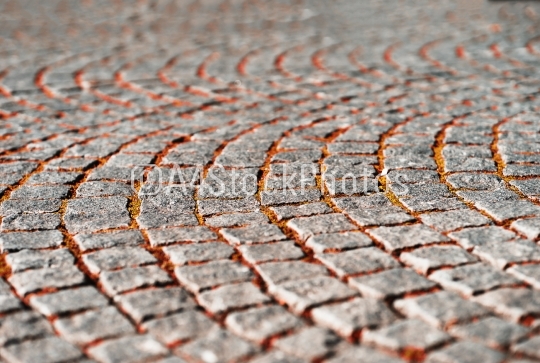 Diagonal medieval Norway pavement with autumn grass background