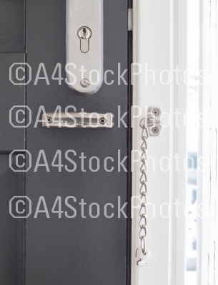 Door chain on a grey door