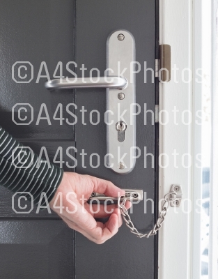 Door chain on a grey door