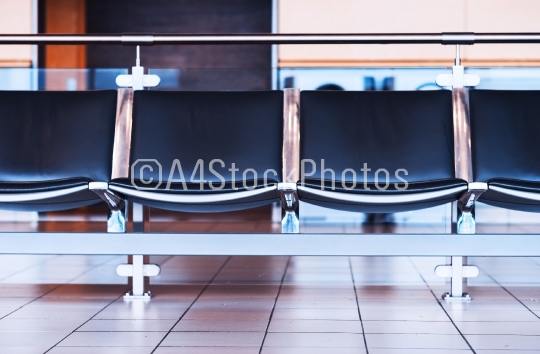 Empty airport seats bench bokeh background