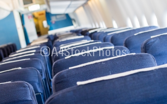 Empty old airplane seats in the cabin, selective focus