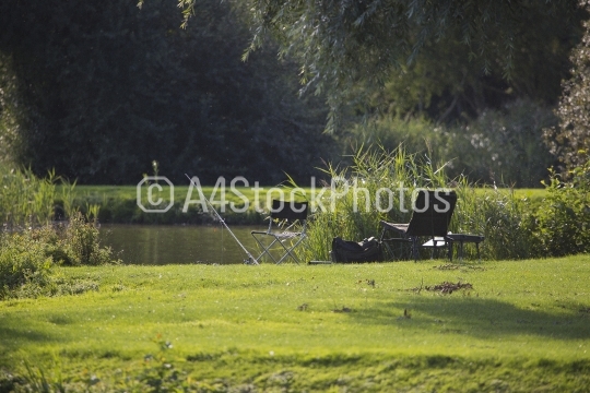 Fishing gear on the banks of a beautiful summer lake