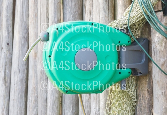 Garden hose hanging on a wall