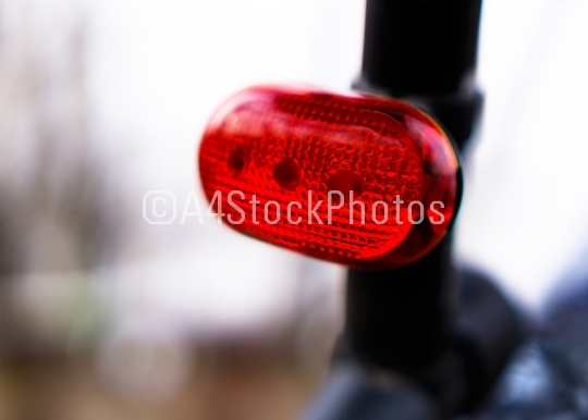 Horizontal vivid rear bike red light bokeh background backdrop