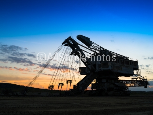 Horizontal vivid sunset industrial mining machine background bac