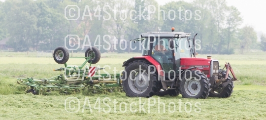 Leeuwarden, the Netherlands - May 26, 2016: Farmer uses tractor 