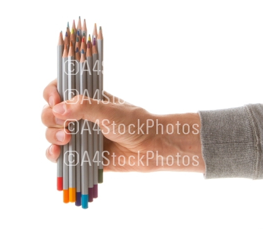 Man holding several color pencils