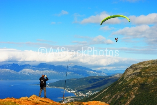 Man taking picture of Norway kite flyer background