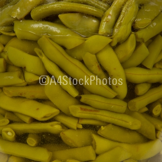 Preserving jar containing french beans, isolated