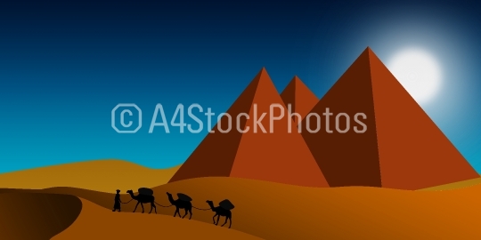 Pyramids with camels walking in the desert