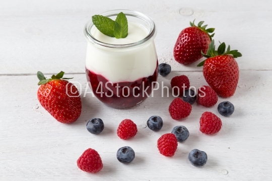 Red fruit compote with mint leaves and fruit