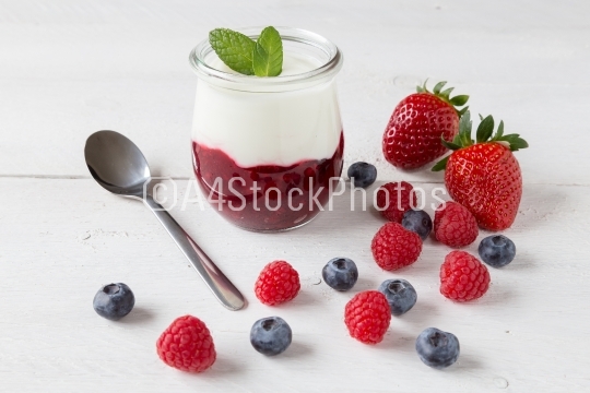 Red fruit compote with mint leaves and fruit