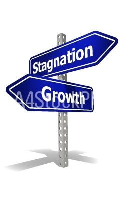 Road sign with stagnation and growth word