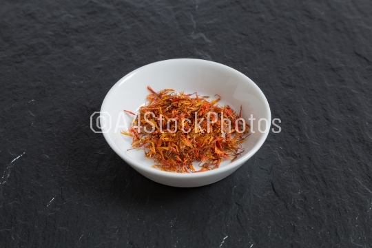 Saffron in a bowl on a slate
