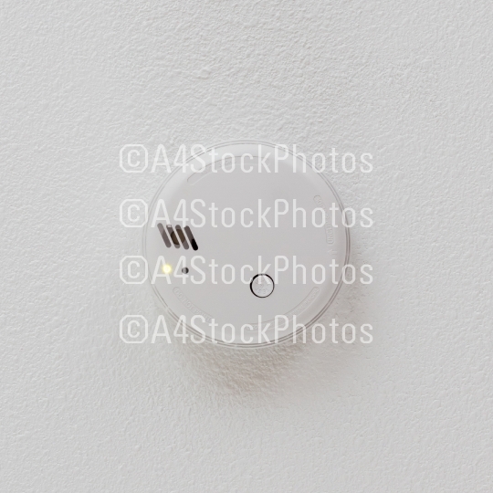 Smoke detector hanging on a ceiling