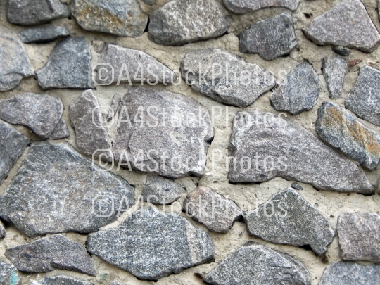 Texture of natural stone material and brick masonry walls