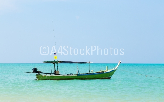 White sand beach and boat
