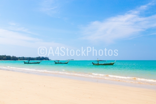 White sand beach and boats
