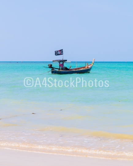 White sand beach and pirate boat
