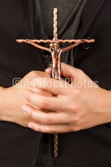 Woman in black with the cross in hands