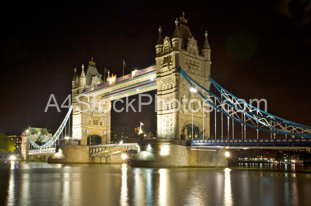 Tower Bridge at night, looking downstream