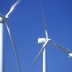 Wind turbines against a clear blue sky
